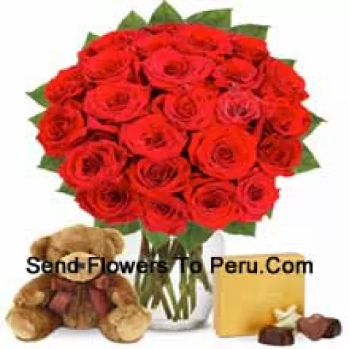 30 Red Roses With Some Ferns In A Glass Vase Accompanied With An Imported Box Of Chocolates And A Cute 12 Inches Tall Brown Teddy Bear