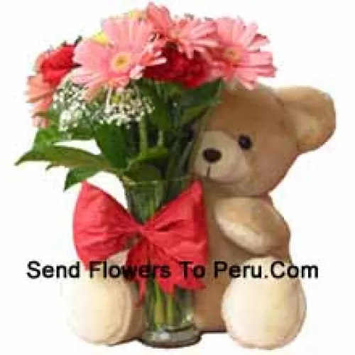 12 Red Carnations And Pink Gerberas In A Glass Vase Decorated With A Bow And Accompanied With A Cuddly Teddy Bear