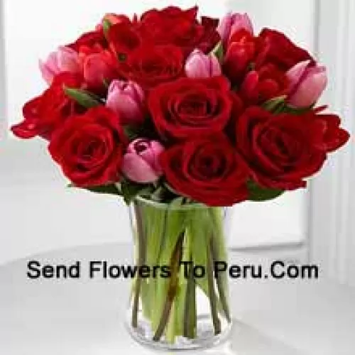 12 Red Roses And 6 Pink Tulips With Some Seasonal Fillers In A Glass Vase