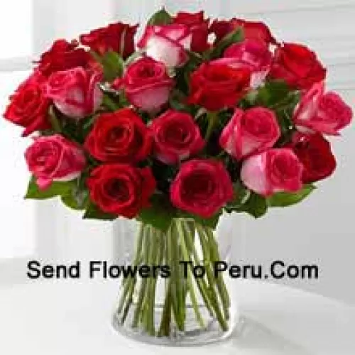24 Roses ( 12 Red And 12 Dual Toned Pink ) With Seasonal Fillers In A Glass Vase